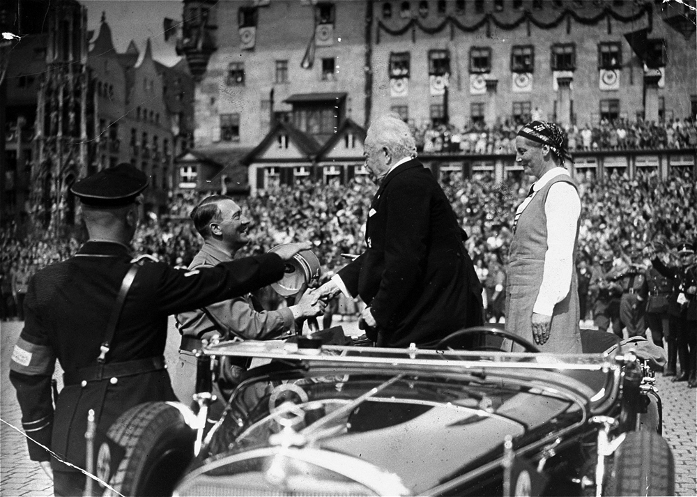 Adolf Hitler greets general Karl Litzmann and his wife on the Adolf Hitler Platz during the Reichsparteitag in Nuremberg